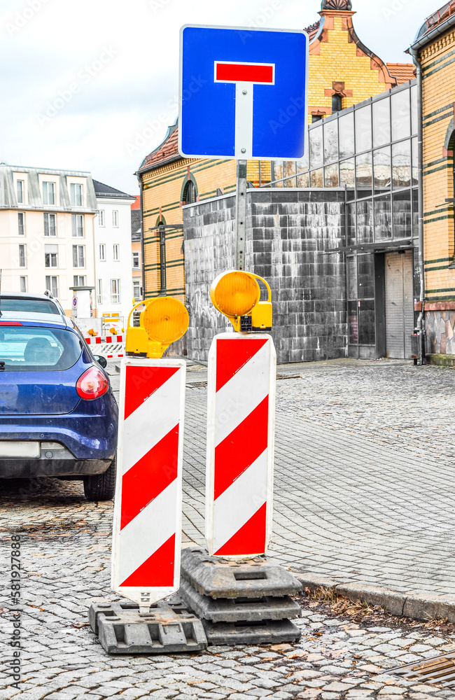 View of warning road signs in city