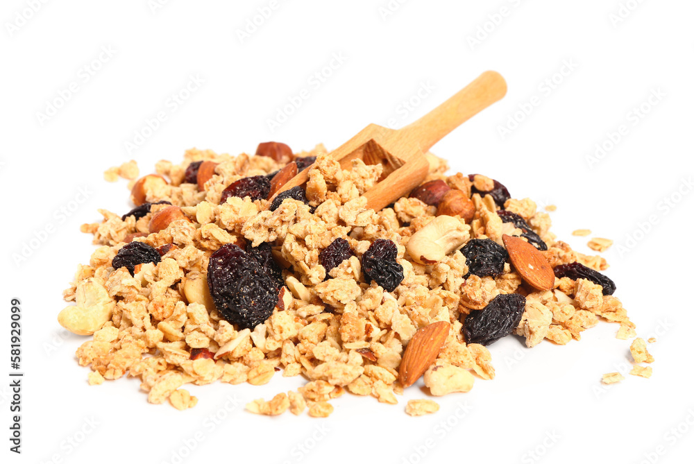 Heap of tasty granola and wooden scoop on white background