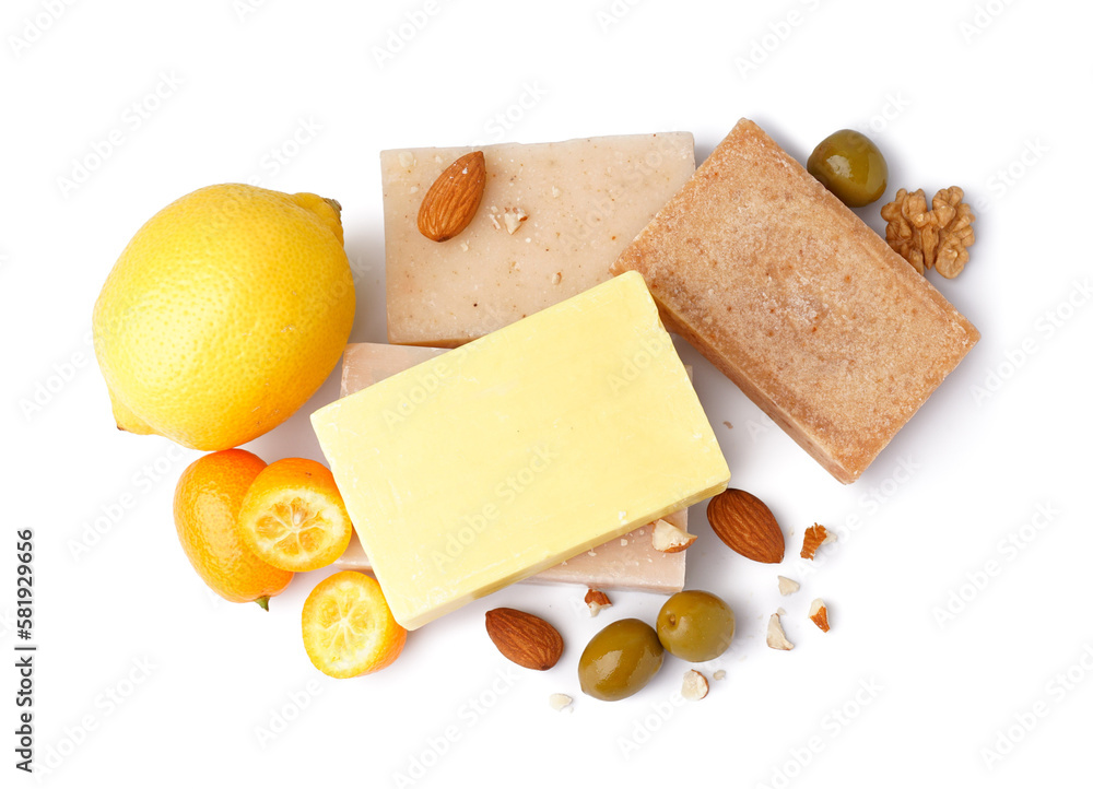 Composition with soap bars and natural ingredients on white background