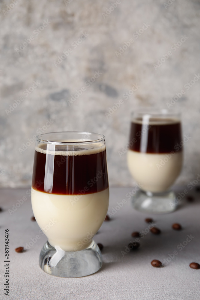 Glasses of tasty Cafe Bombon on light table