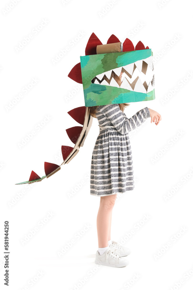 Little girl in cardboard dinosaur costume on white background