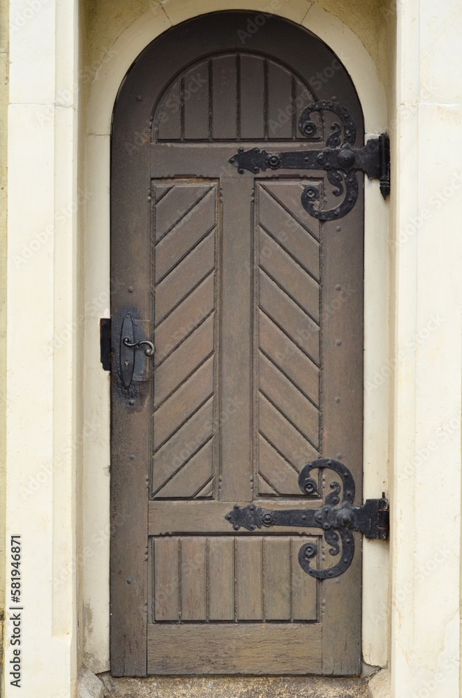 View of old building with wooden door