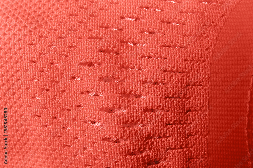 Closeup view of coral knitted fabric texture as background