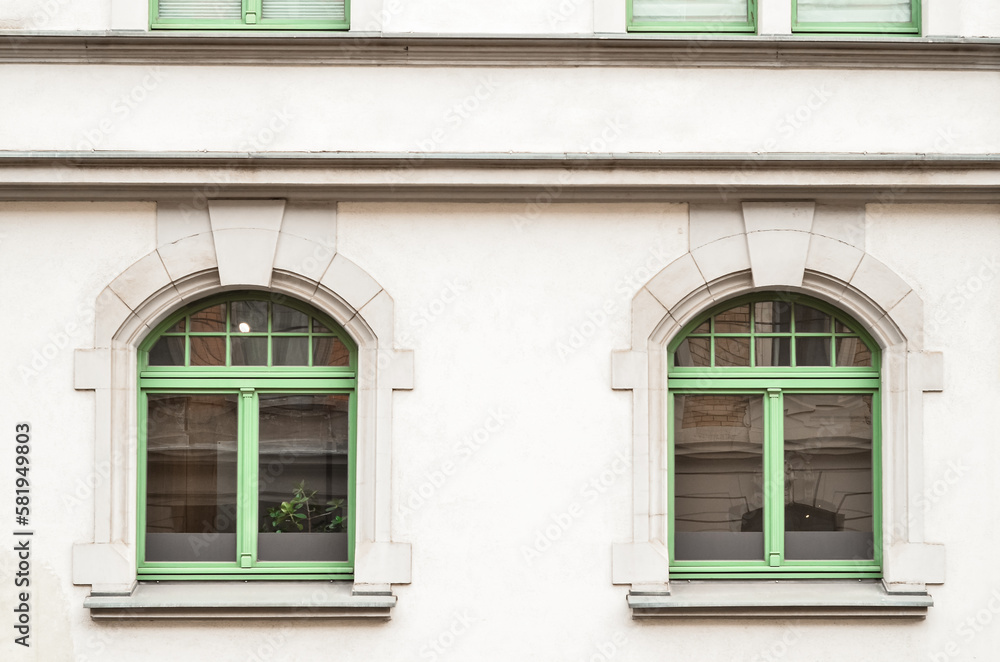 View of beautiful building with green windows