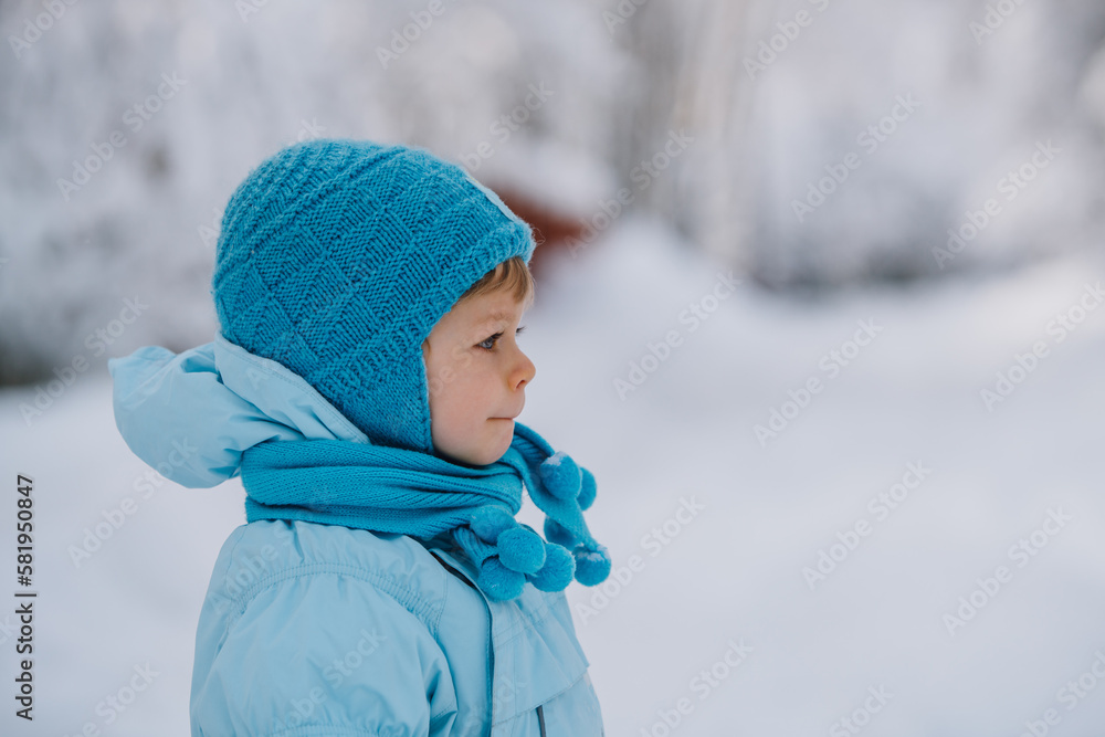 Two year child in blue suit winter portrait