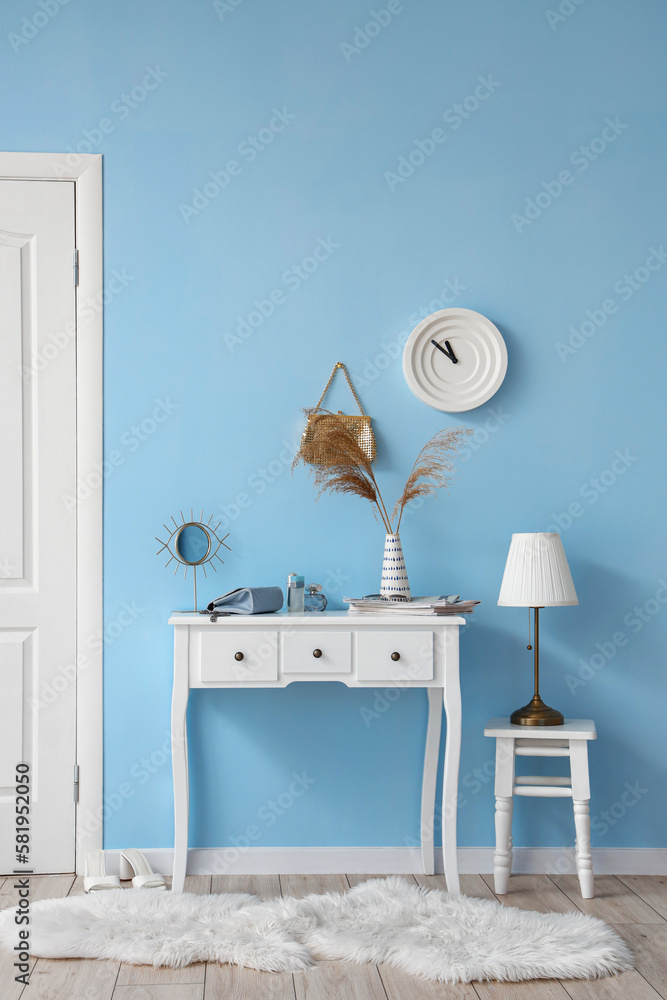 Interior of stylish hall with table and stool