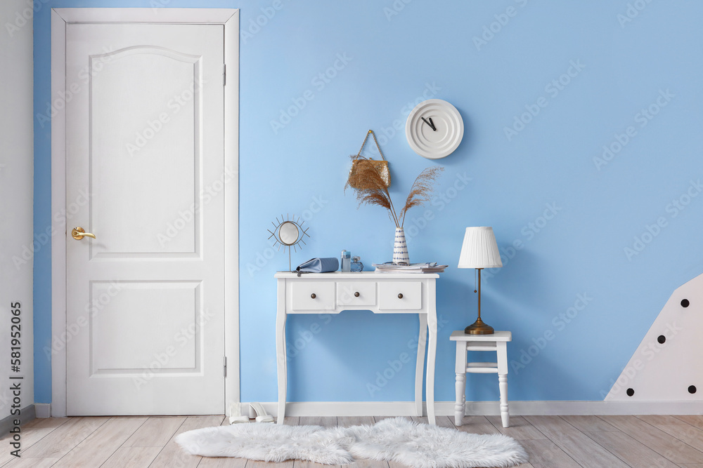 Interior of stylish hall with table and stool