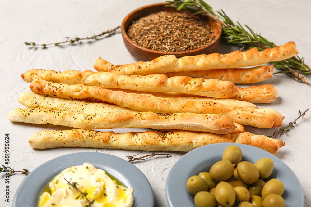 Tasty Italian Grissini on light background