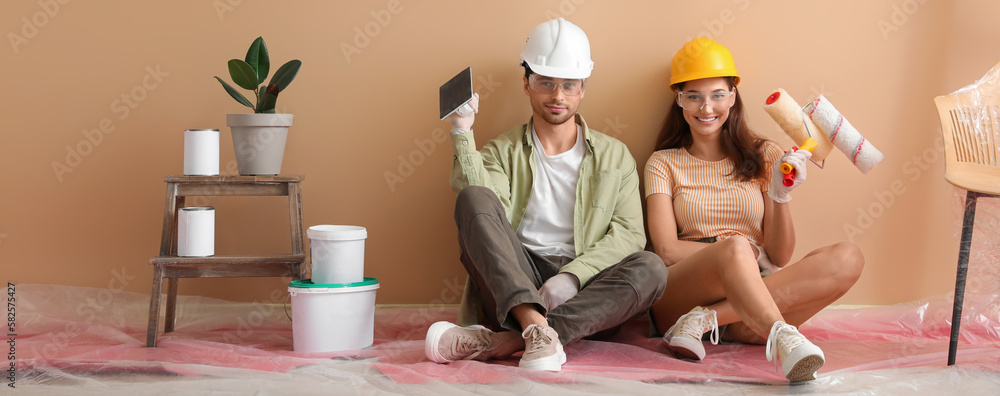 Happy young couple resting after making repair in their new house