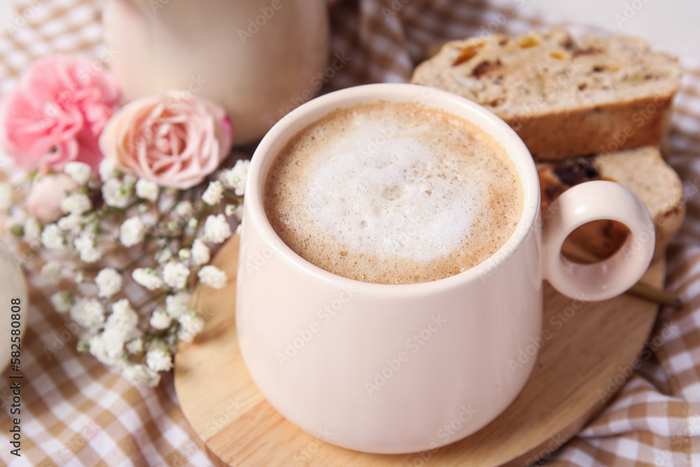 Delicious biscotti cookies and cup of coffee on napkin