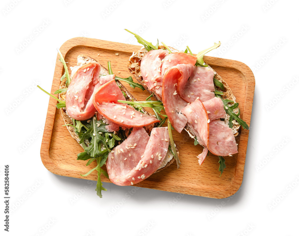 Wooden board of tasty bruschettas with ham isolated on white background