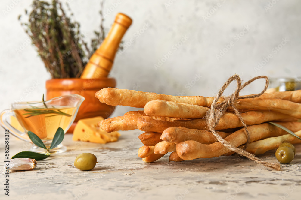 Bunch of tasty Italian Grissini on table, closeup