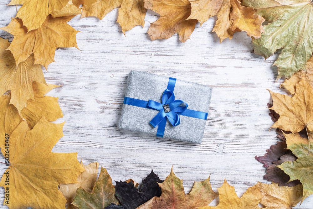 Flat lay autumn composition with gift box