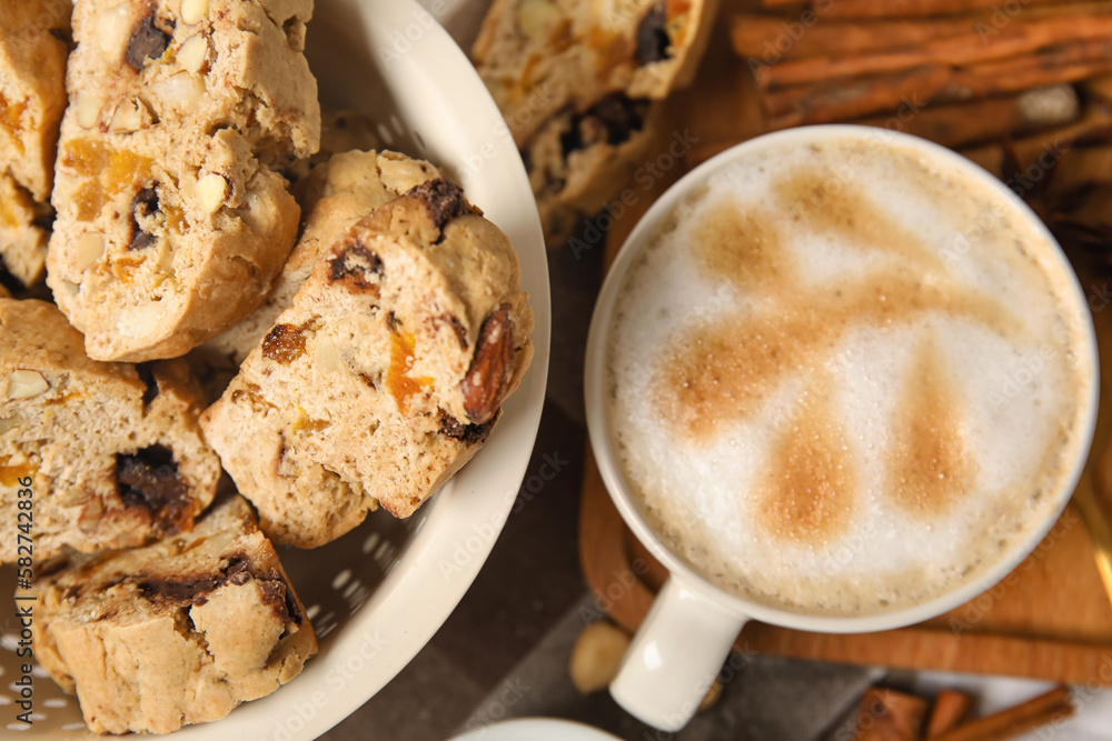 Delicious biscotti cookies and cup of coffee, closeup