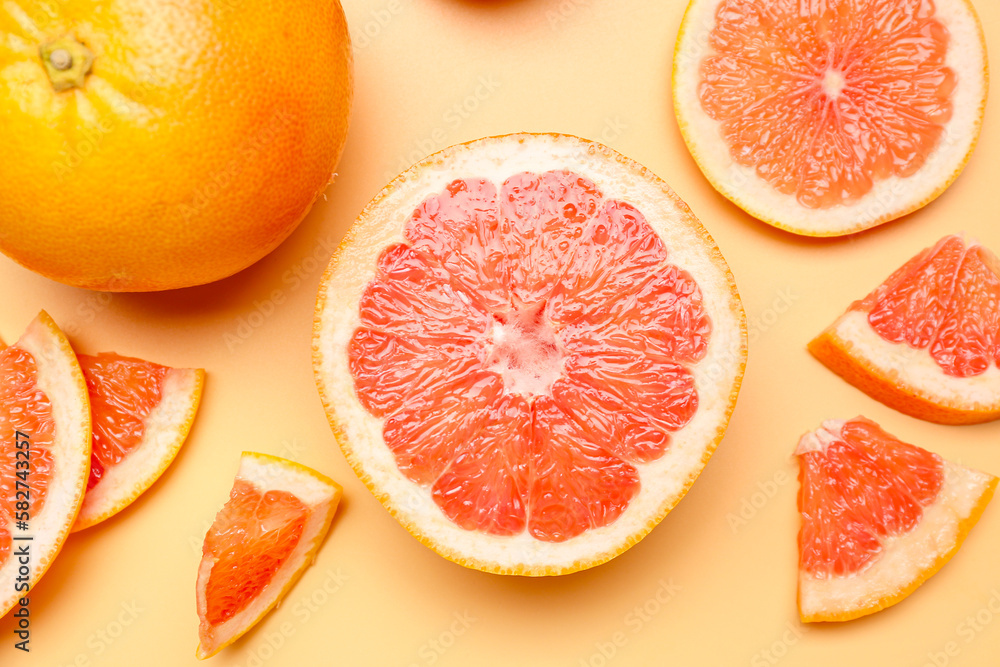 Composition with ripe grapefruit on color background, closeup