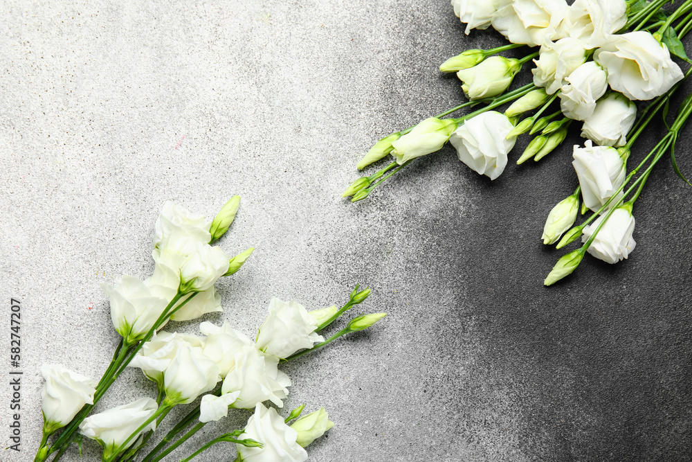 Beautiful eustoma flowers on black and white background