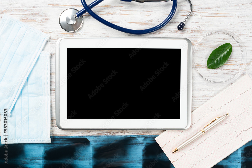 Mock up of doctors desktop with medical supplies