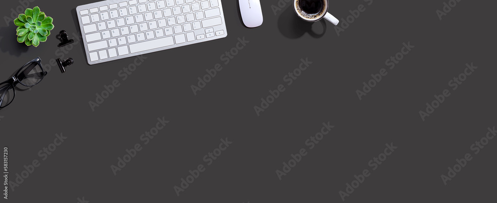 Computer keyboard with a cup of coffee and eyeglasses - flat lay