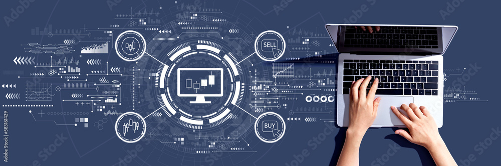 Stock trading theme with person using a laptop computer
