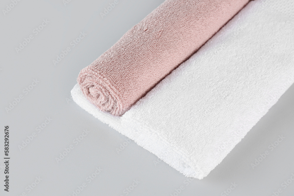 Cotton soft towels on grey background