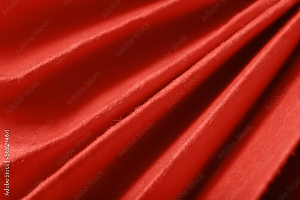 Closeup view of coral folded paper texture as background