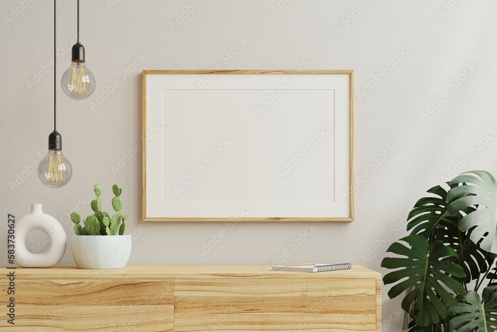 Horizontal picture frame mockup on empty wooden cabinet.