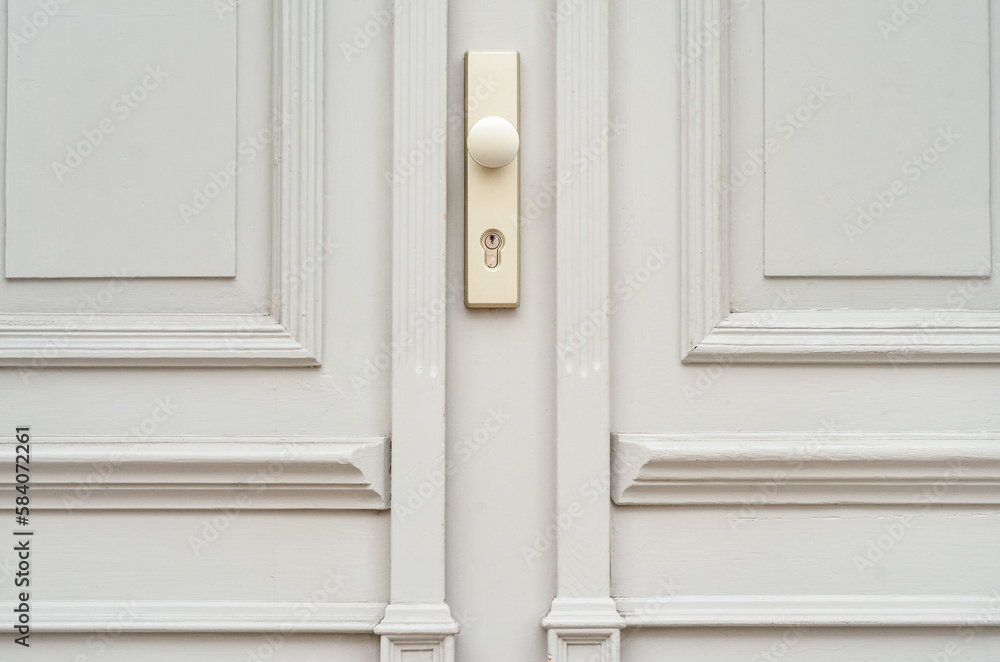 View of white wooden door in city, closeup