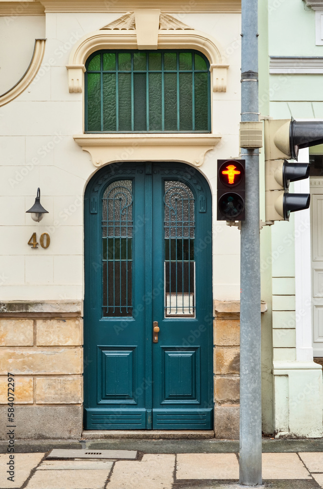 View of old building with blue wooden door