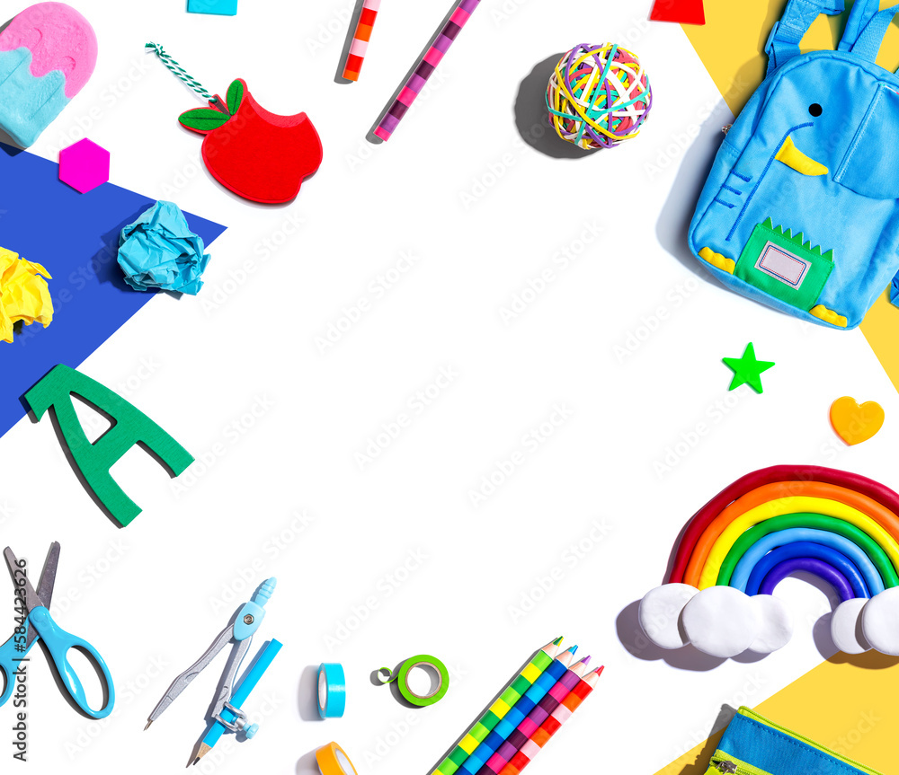 School supplies with a rainbow - overhead view - flat lay