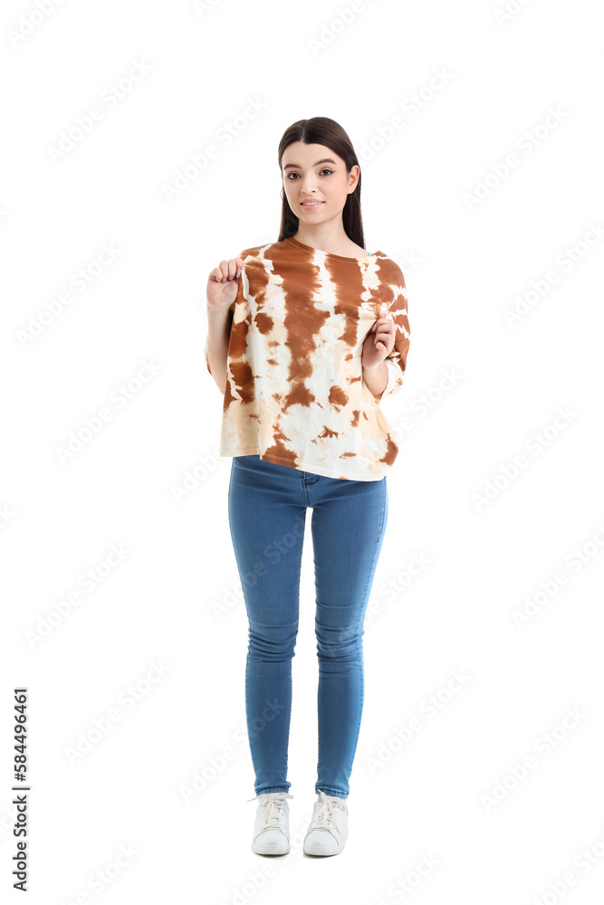 Stylish young woman in tie-dye t-shirt on white background