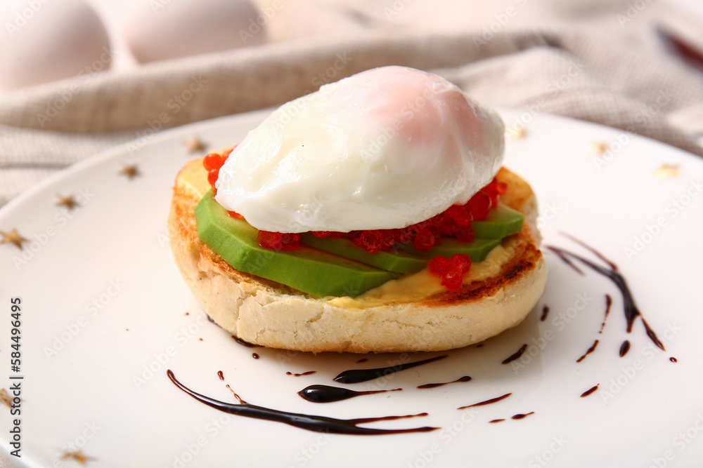 Plate with tasty egg Benedict on white table, closeup