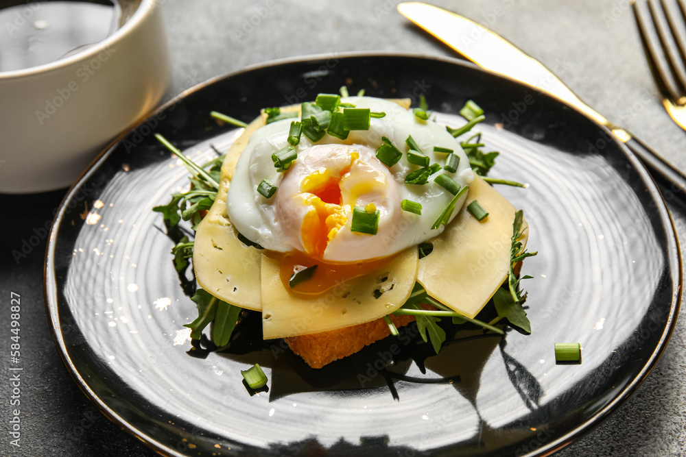 Plate with tasty egg Benedict on table, closeup