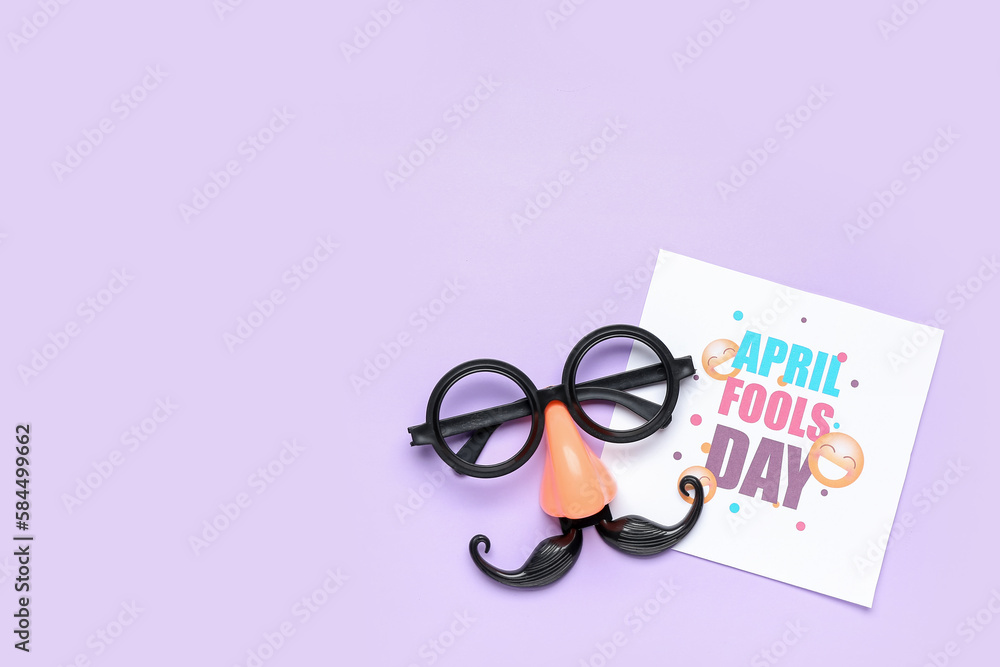 Card with text APRIL FOOLS DAY and funny disguise on lilac background