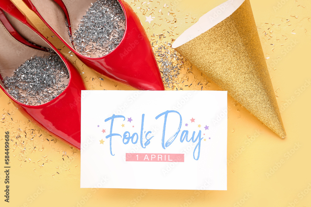 Card for April Fools Day, heels with confetti and party hat on yellow background