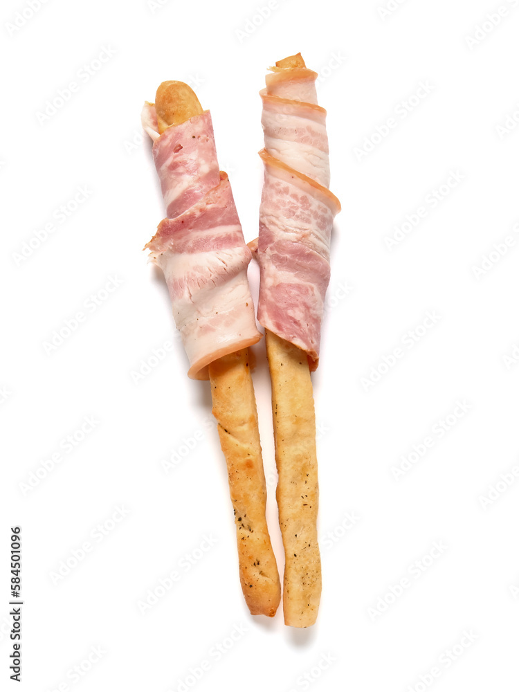 Tasty Italian Grissini with bacon on white background