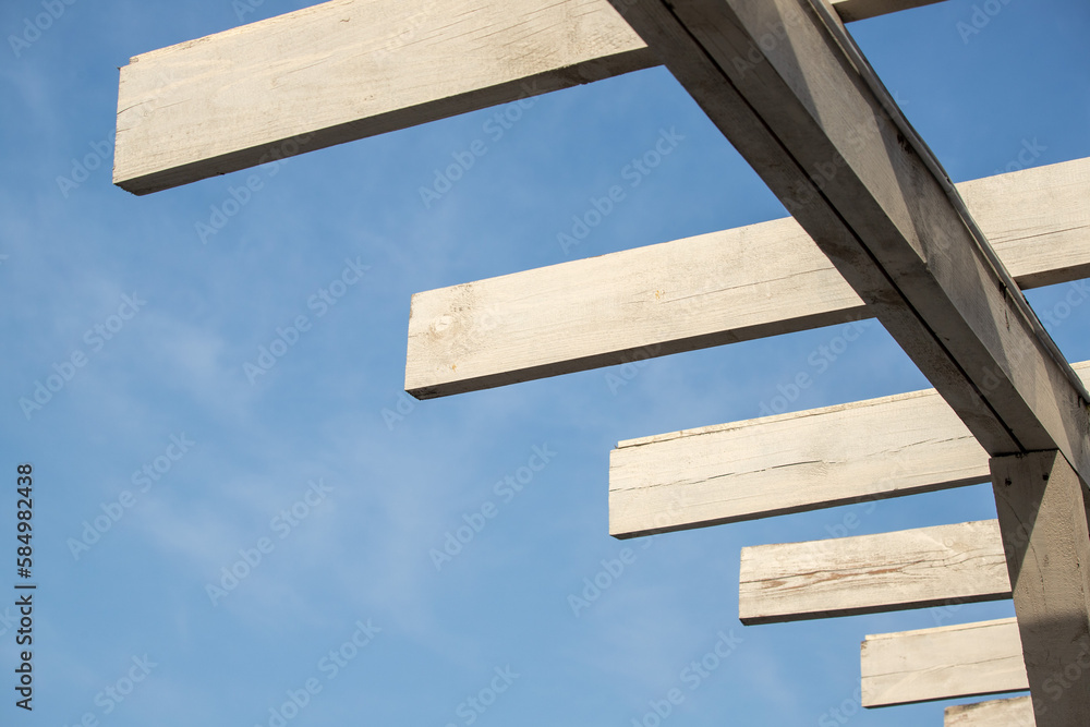 Roofs of houses with dormer windows against the sky. Urban architecture.