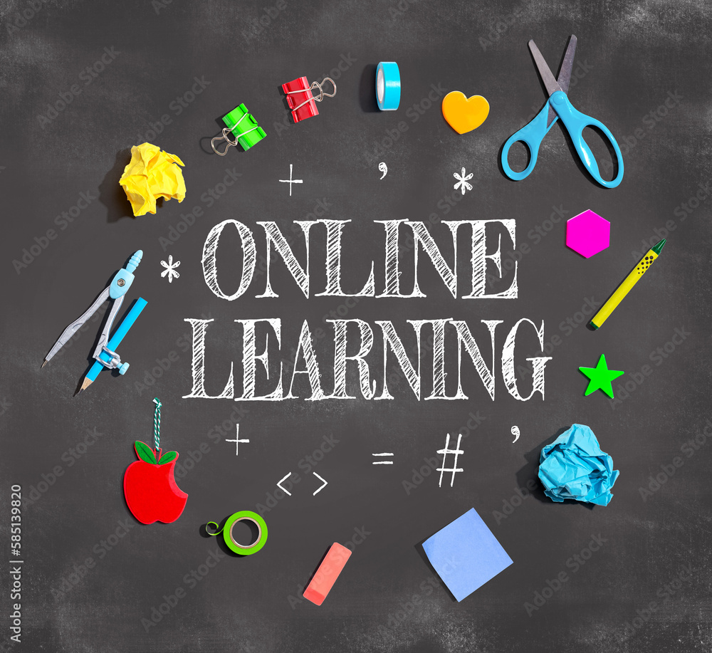 Online Learning theme with school supplies on a chalkboard - flat lay