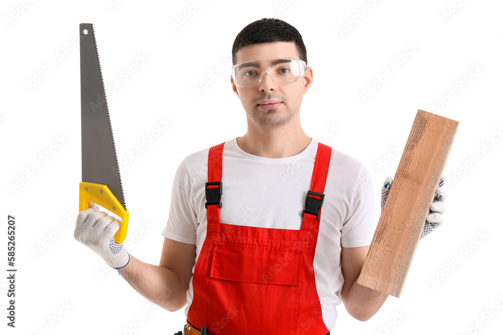 Young carpenter with wooden plank and handsaw on white background