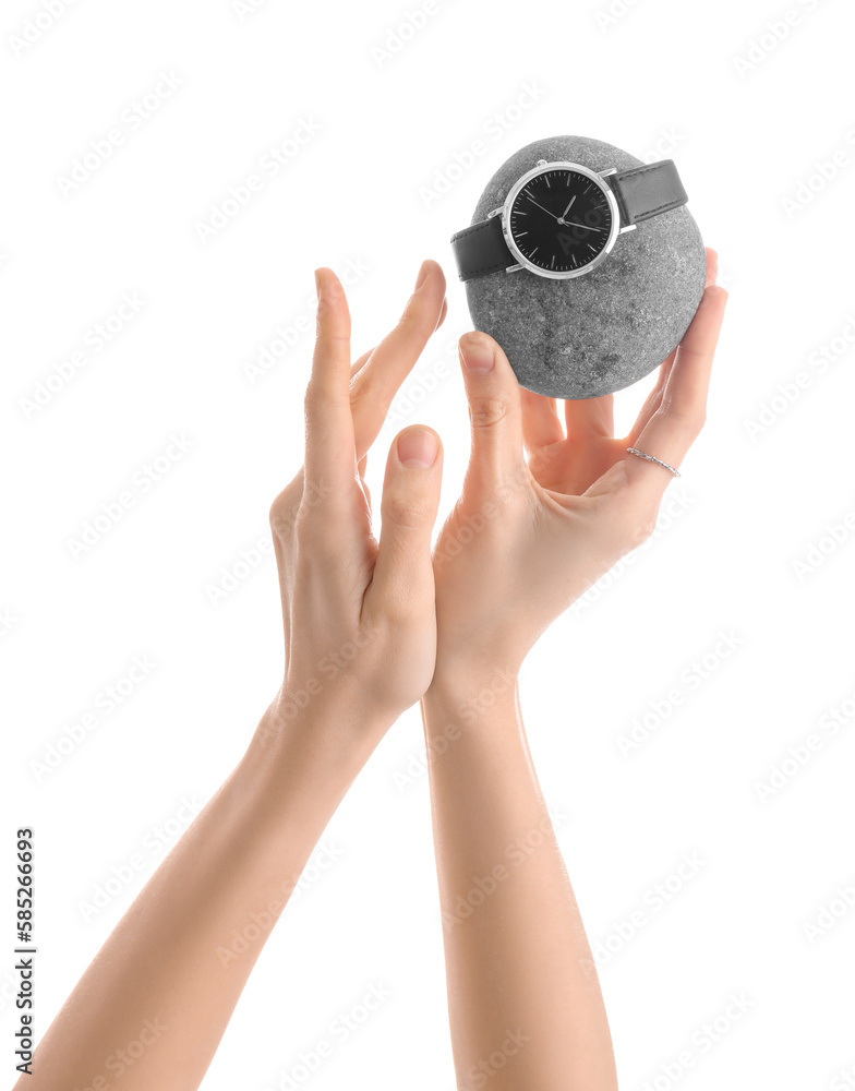 Woman with spa stone and stylish wristwatch on white background