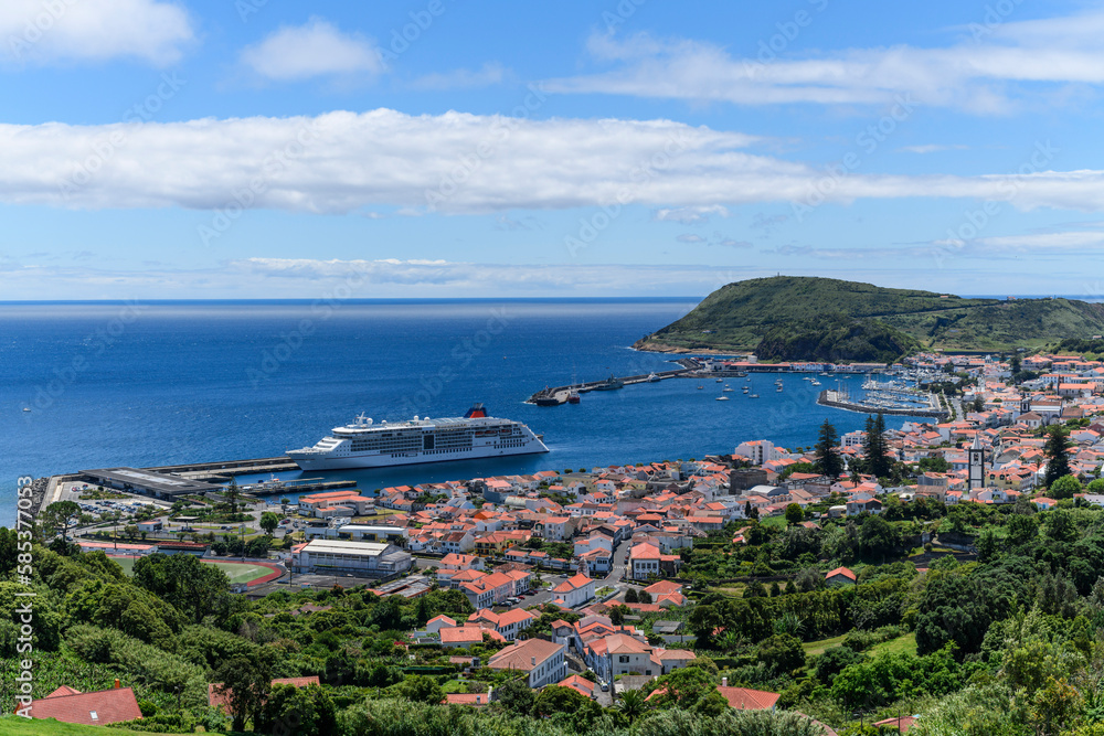 View over Horta, there is a cruise ship in the harbour / View over the city of Horta, a cruise ship 