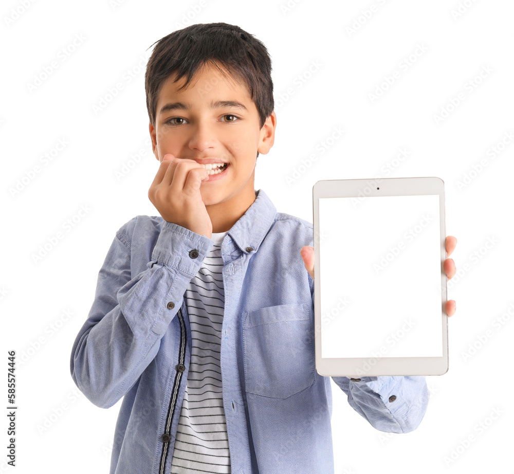 Little boy with tablet computer biting nails on white background