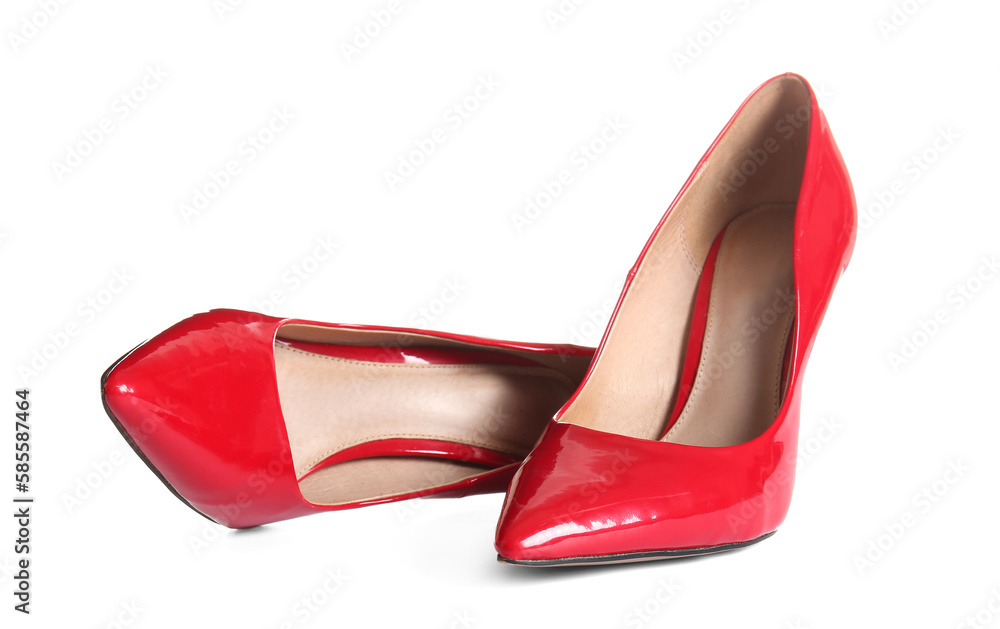 Pair of red high heeled shoes on white background