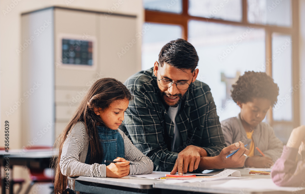 Man mentoring elementary school children. Teacher showing kids how to draw in a class