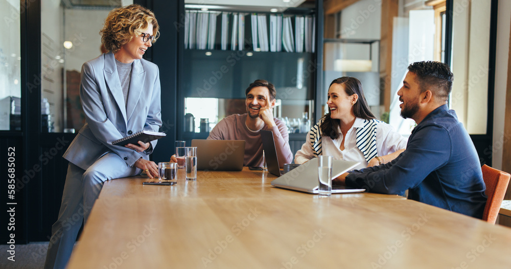 Group of tech professionals having a meeting in a boardroom