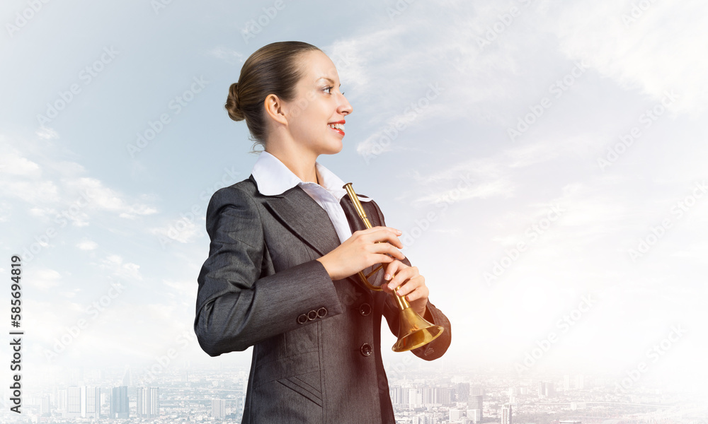 Business woman playing the trumpet