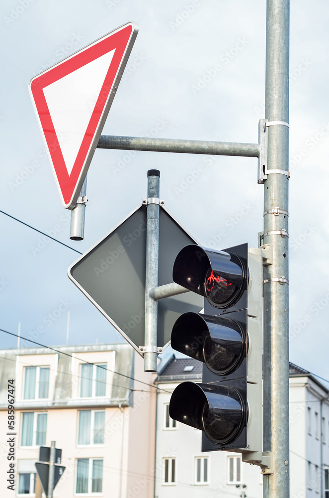 View of traffic lights with sign in city, closeup