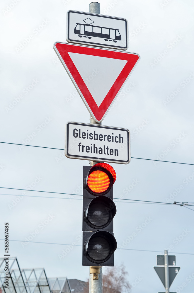 View of traffic lights with signs in city, closeup