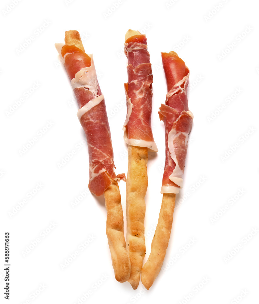 Tasty Italian Grissini with bacon on white background