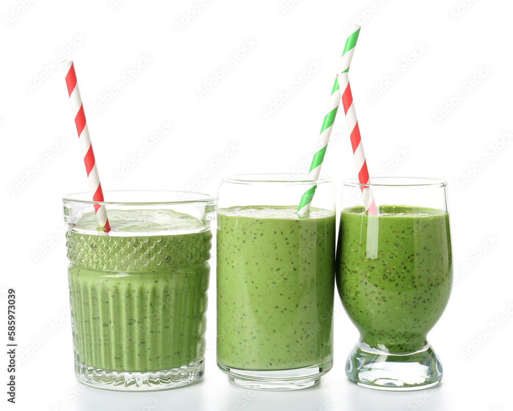 Glasses of tasty green smoothie with straws on white background