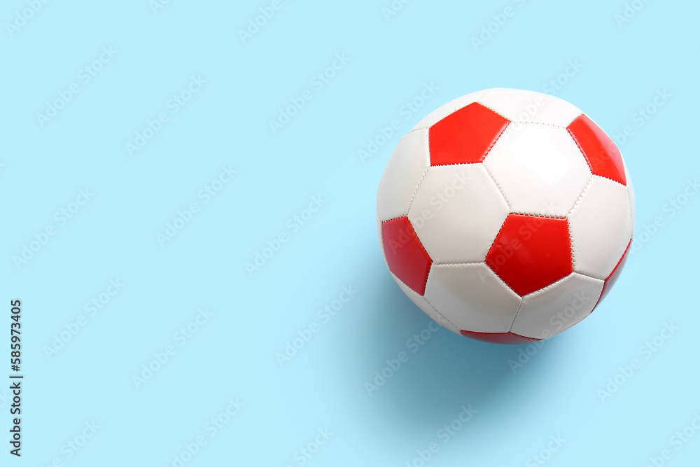 Soccer ball on light blue background